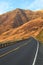 Washington State Route 821 winding through the Yakima Canyon with white road edge line