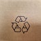 A waste carton box paper with black recycling icon
