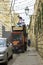 Waste collection Jerusalem style in the narrow streets of the Ar