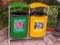 Waste sorting, two colorful bins with pictures and messages on the campus site. Green bin for