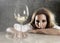 Wasted alcoholic woman depressed looking thoughtful with white wine glass