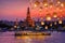 Wat arun and cruise ship in night time and floating lamp in yee peng festival under loy krathong day, Bangkok city ,Thailand