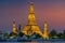 Wat Arun stupa, a significant landmark of Bangkok, Thailand, stands prominently along the Chao Phraya River, with a beautiful