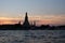 Wat Arun Temple stands on the banks of the Chao Phraya River at dusk