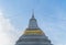 Wat Chantharam Worawihan or Wat Klang Talat Phlu, a Buddhist temple stupa at noon with blue sky in Bangkok city, Thailand. Thai