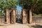 Wat Si Sawai, Sukhothai, Thailand - 12.27.2018; entrance with tourists to Wat Si Sawai in the Historical Park of Sukhothai