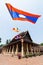 Wat Sisaket with colourful Buddhist religious flags on foreground in Vientiane, Laos