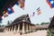 Wat Sisaket with colourful Buddhist religious flags on foreground in Vientiane, Laos