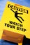 Watch your step sign