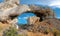 Watching through natural arch stone near la Ciotat