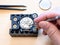 Watchmaker fixes mechanism of mechanical watch