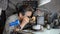 Watchmaker in his workshop repairing a wrist watch