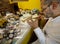 Watchmaker repairs mantelclock in his laboratory