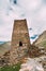Watchtower Of Ancient Fortress On Mountain Background Near Karatkau