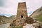 Watchtower Of Ancient Fortress On Mountain Background Near Karatkau