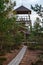 watchtower details and wooden bars, stairs and walls from below up