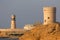 Watchtower and lighthouse in the bay of Sur, Oman