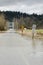 Water across a rural road in Duvall Washington during river flooding