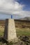 Water bottle on top of a mountain cairn in the Scottish Highlands