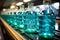 Water bottles on a conveyor belt, beverage factory operates a production line, processing and bottling drink