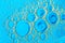 Water bubbles on blue and yellow background. Scientific image of cell membrane. Macro up of liquid substances. Abstract molecule a