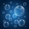 Water bubbles with reflection on blue background. Realistic underwater bubbles. 3d bubble. Fizzing air bubbles. Vector