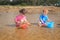 Water and bucket play at the beach