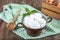 Water buffalo yogurt fermented in copper bowl. Homemade Yogurt in bowl on wooden table, top view, copy space. Organic plain greek