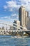 Water buses sailing on the Sumida river under the Tsukiji Ohashi bridge.