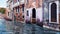 Water canal and ancient buildings in Venice, Italy