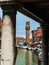 Water Canal with Boats and San Giacomo Bell Tower in Murano Island near Venice - Italy