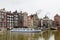 Water canal with sightseeing tourism boat in Amsterdam, Holland