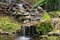 Water cascade flowing down the rocks in the farm in Costa Rica