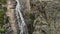 Water Cascades Down Rocky Cliff Side