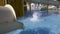 Water cascading down off a water slide at a fairground