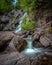 Water cascading down a secluded waterfall in Terra Nova National Park - Newfoundland, Canada.