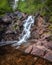 Water cascading down a secluded waterfall in Terra Nova National Park - Newfoundland, Canada.