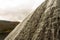 Water cascading down stone dam, Ladybower reservoir.