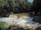 WATER CASCADING DOWN A WEIR IN A RIVER