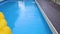 Water Caustic Background. water waves and lines of blue tile swimming pool.