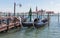 Water channels of Venice city. Parking gondolas near St. Mark`s Square on Grand Canal in Venice, Italy.