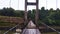 Water Color style image illustration Suspension bridge over the river. Wooden suspension bridge