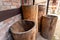 Water containers made of wood. Old barrels carved from the trunk of a tree