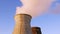 Water cooling tower stack smoke over blue sky