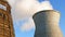 Water cooling tower stack smoke over blue sky