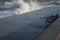 Water crashing on cement pier