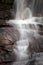 Water creates dramatic patterns as it falls over rocks