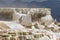 Water dripping from the white travertine ledge of Mammoth terraces