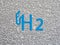 Water drop background with H2 hydrogen symbol