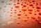 water droplet abstract circle pattern on orange red color glass